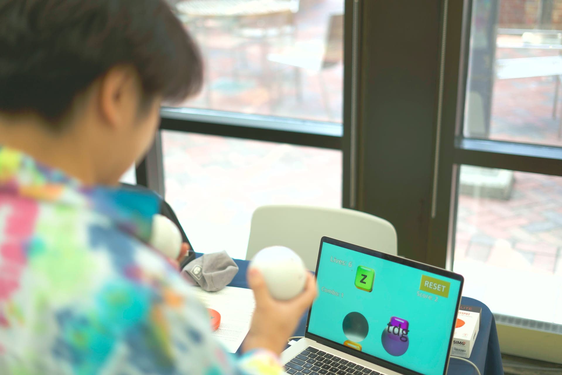 Kids playing Qubi Hero at the booth